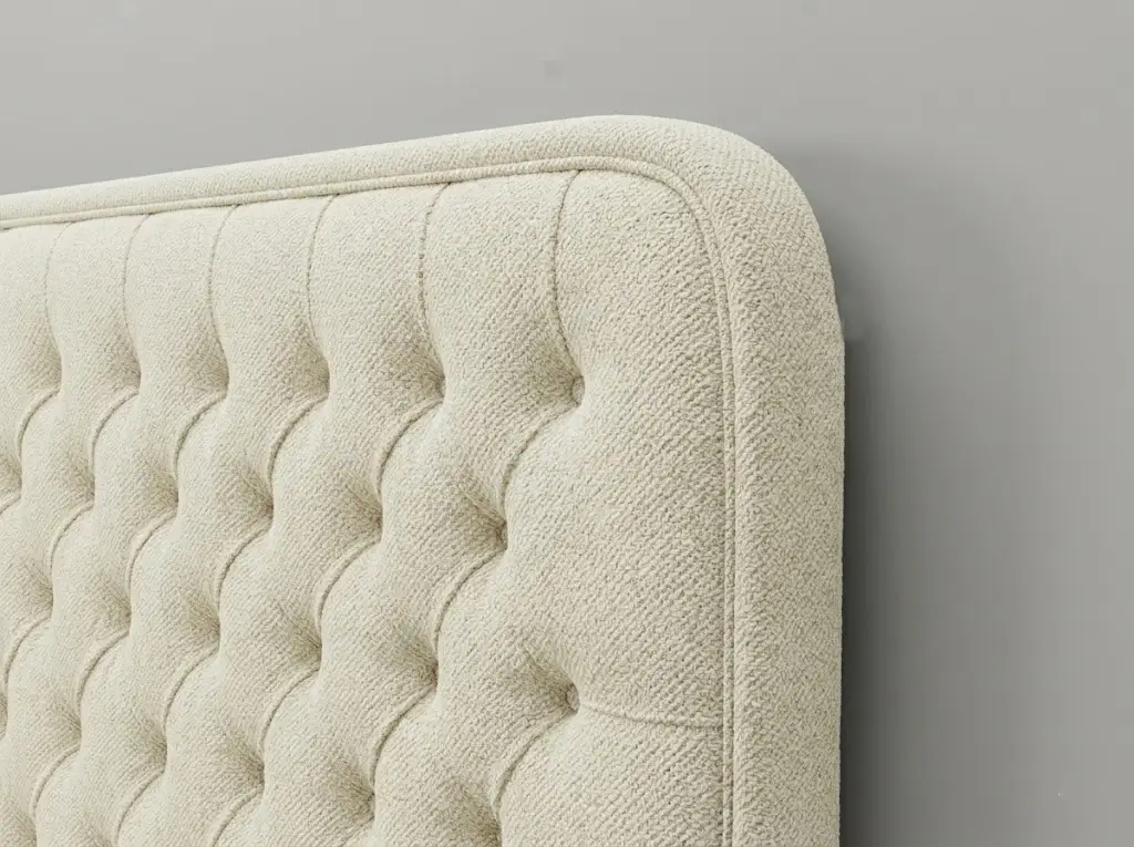 Upholstered headboard detail — tufting and welt — Era Interiors