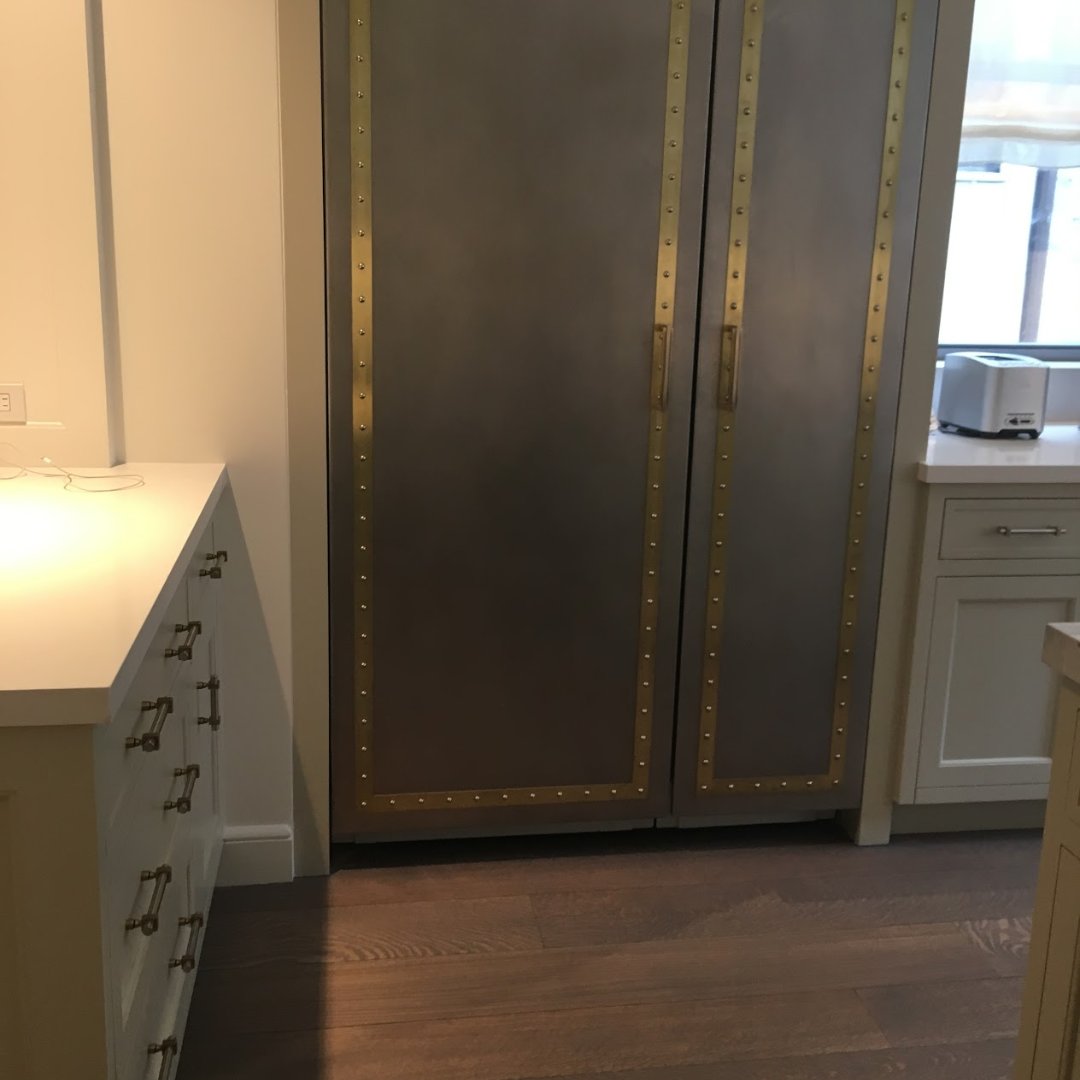 kitchen millwork with brass detail