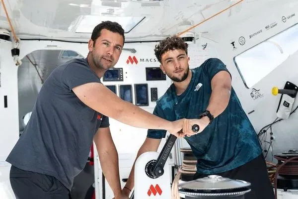 Inoxtag and Guirec Soudée inside a racing sailboat