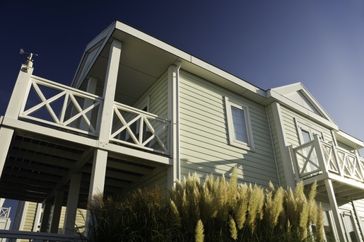 houses along coast with impact hurricane coastal windows