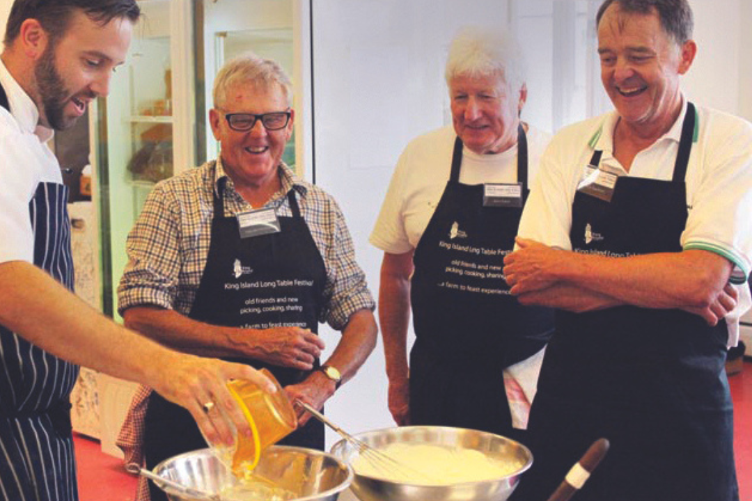 Expressions Australia fundraising aprons wearing by 4 guys