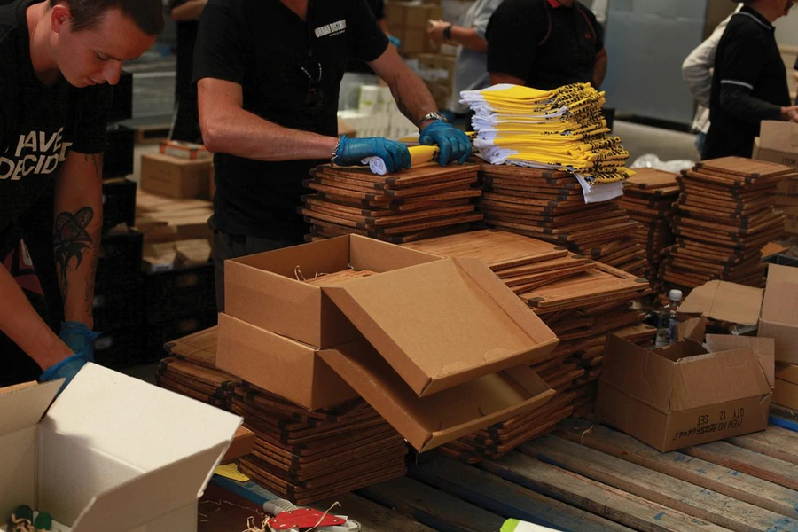 Stacked Expressions tea towels being packed for OzHarvest fundraiser.