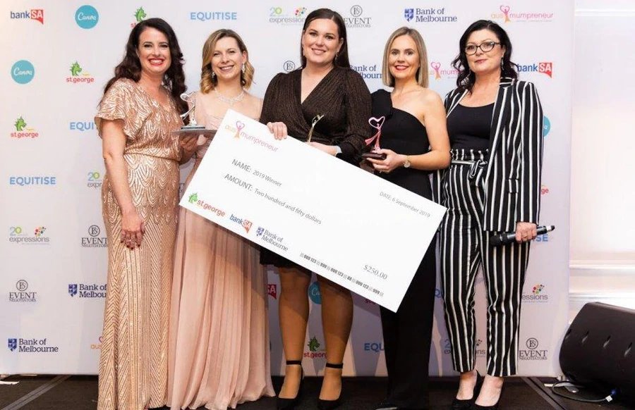 Expressions Fundraising team celebrating at Ausmumpreneur Awards 2019 holding winner’s cheque.