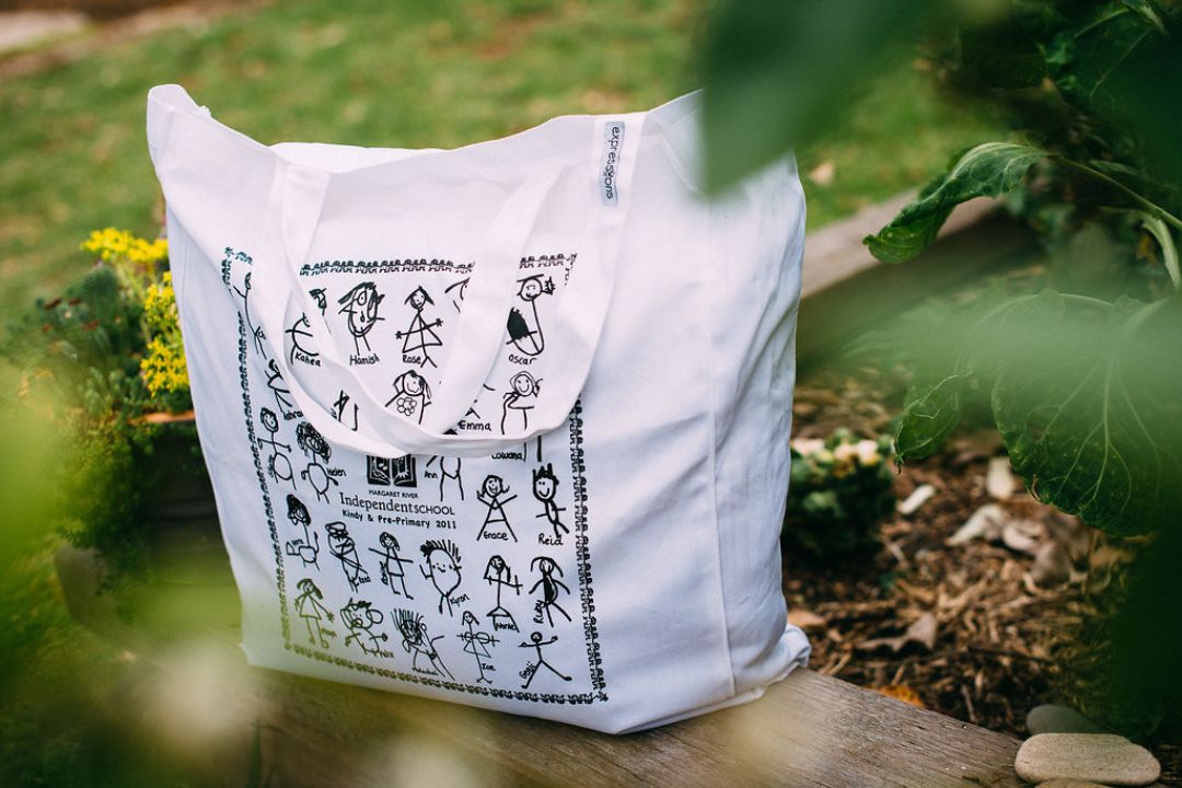 Children's drawing printed on white tote bag for childcare fundraiser