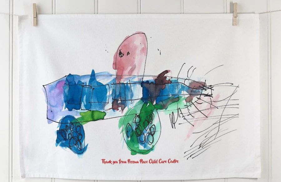 Children’s drawing printed on organic cotton thank-you tea towel from Possum Place Child Care