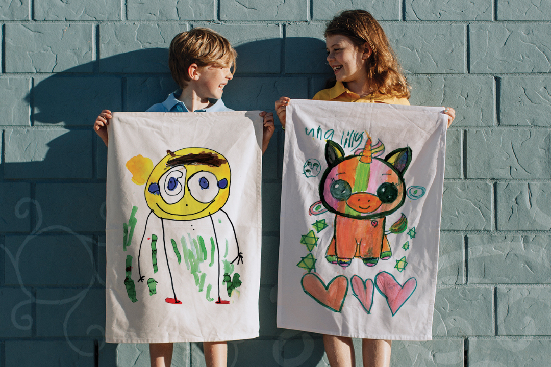 Tea towel design featuring student artwork and custom belly band