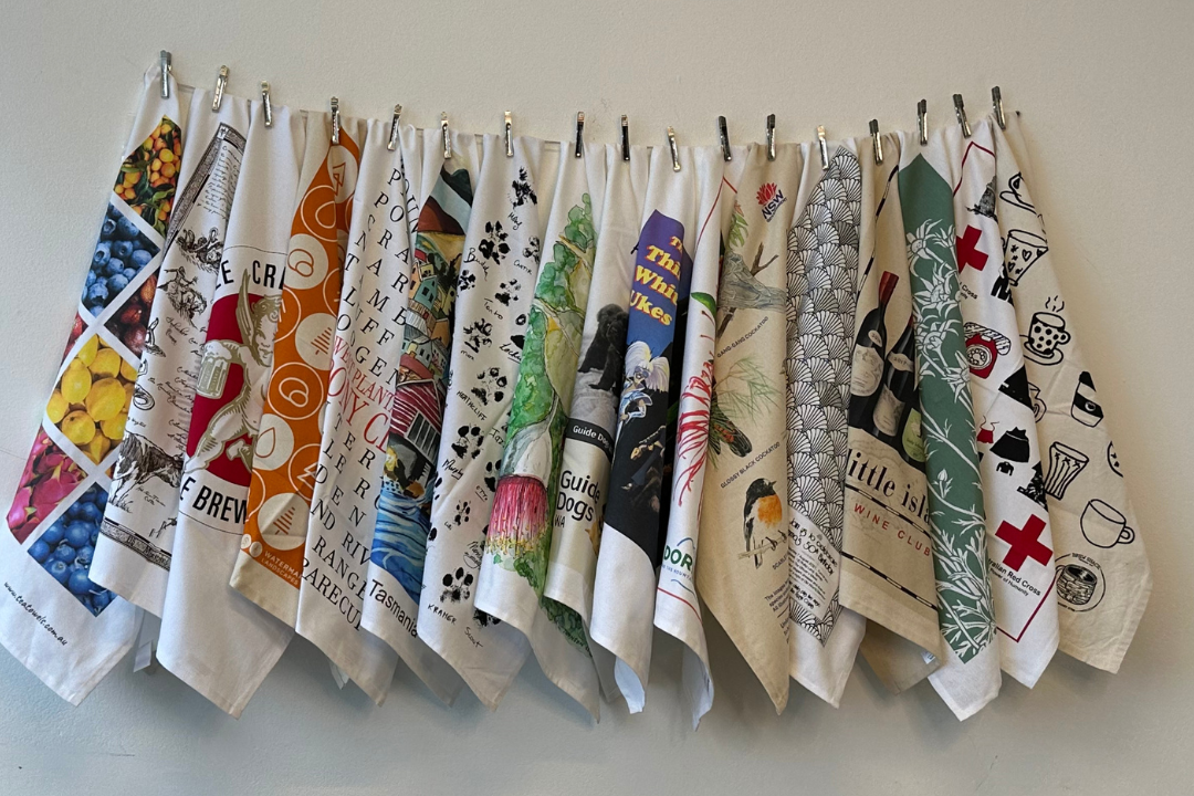 Emma, founder of Expressions, celebrating 25 years of school tea towel fundraising