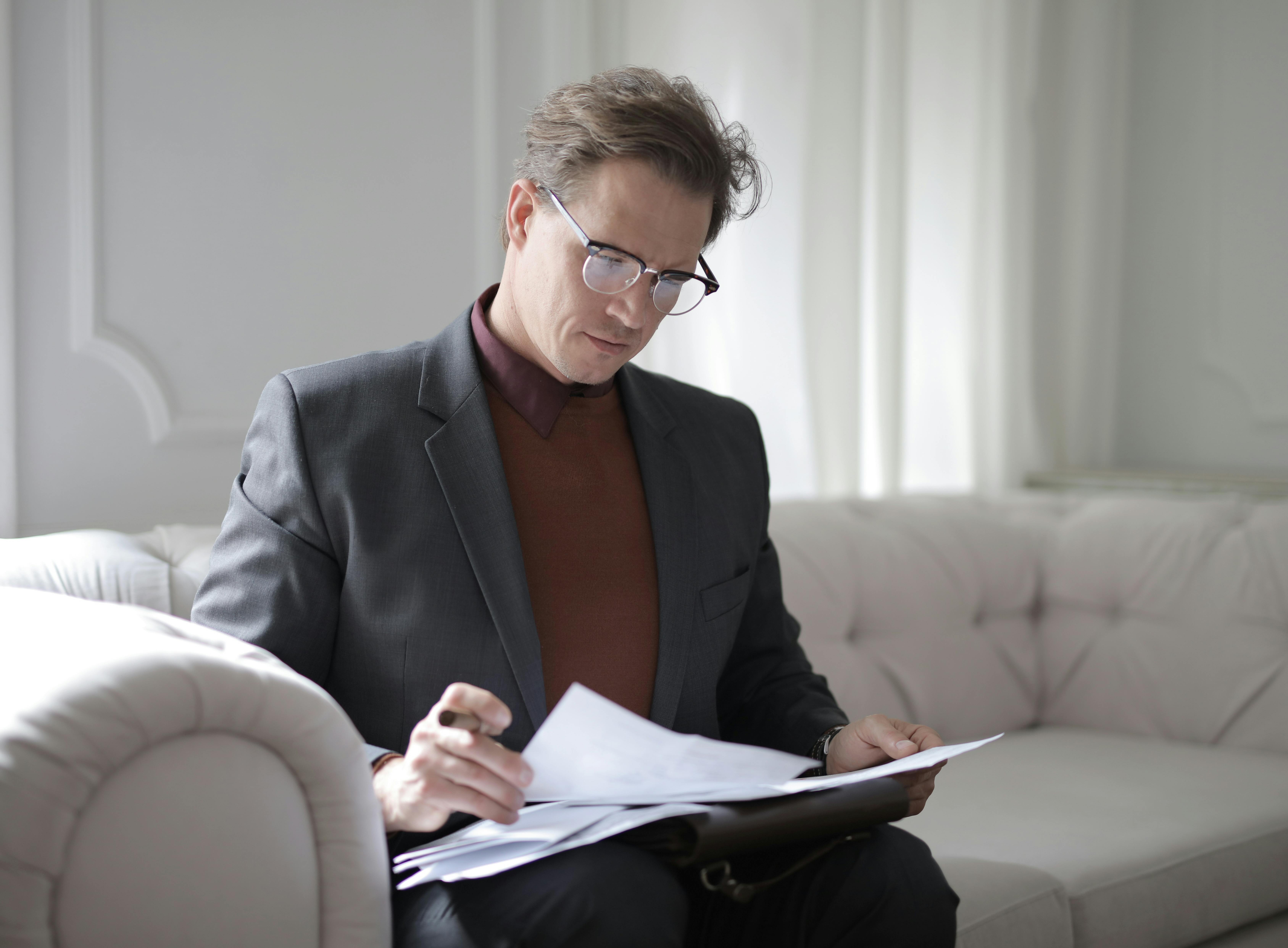 A person thoughtfully looking at plan options on a screen.
