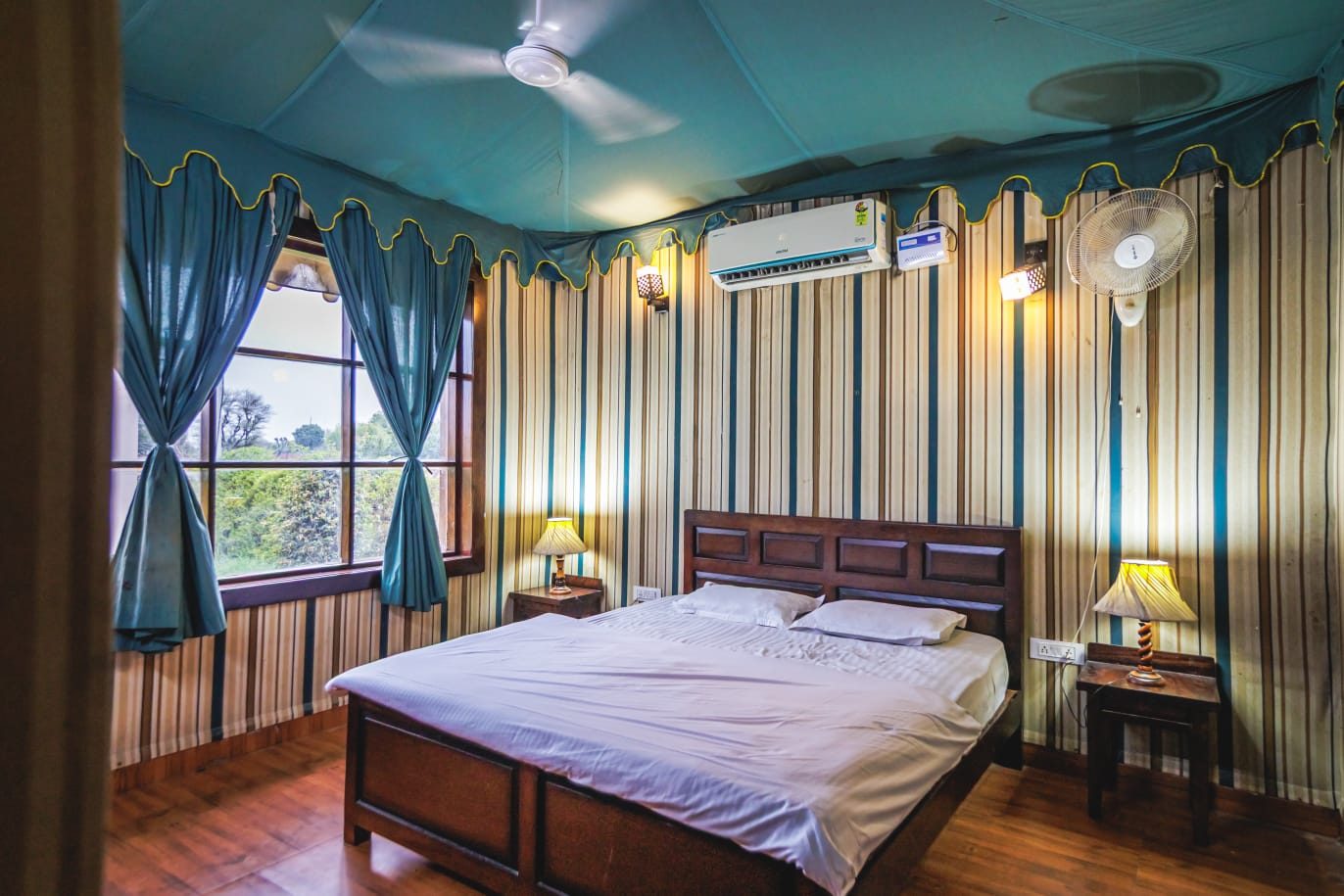 Air-conditioned bedroom and indoor lounge at Suryansh Outhouse, Vaishali Estate, Vaishali Nagar, Jaipur (Photo 8)