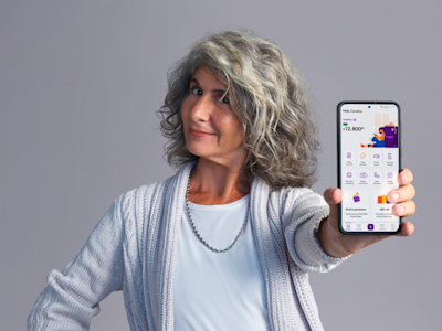 An older woman with an orange background