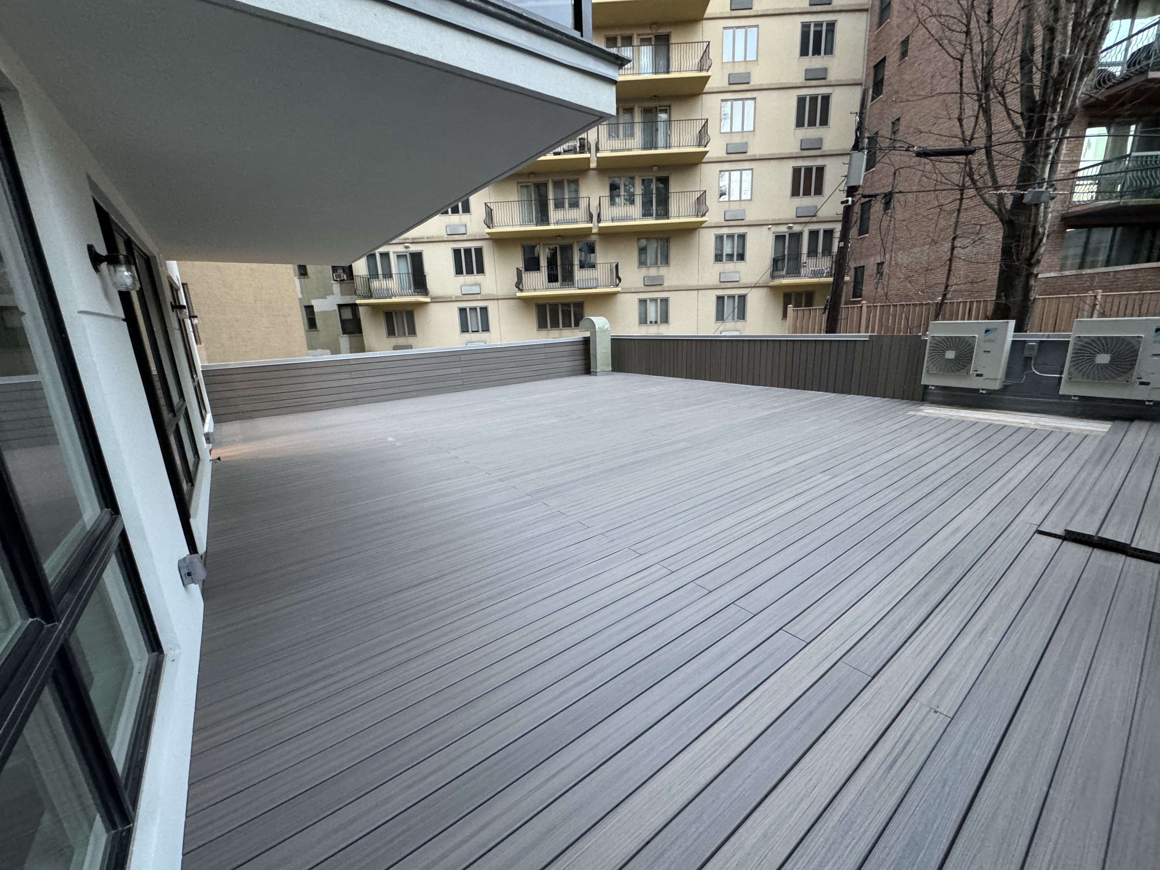 New rear deck Construction  — Exterior renovation project by Fenix Construction