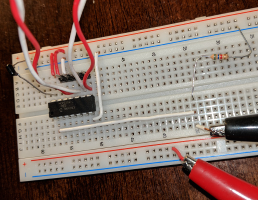 Breadboard with ADC connected to voltage divider and Raspberry Pi