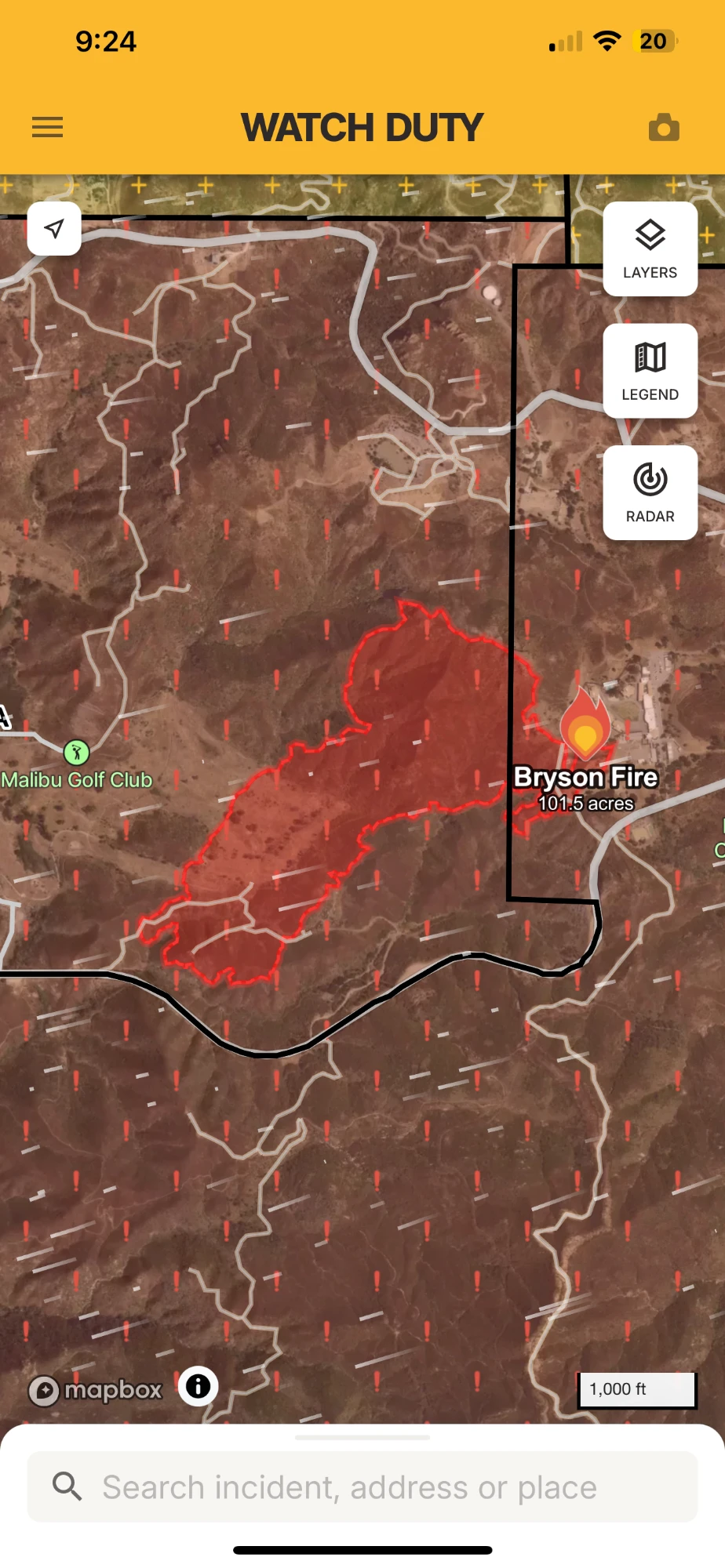 The Watch Duty app at 9:24 p.m. on Oct. 15, 2026: the Bryson Fire in Malibu, California, 101.5 acres, outlined in red near Malibu Golf Club, inside a red flag warning area.