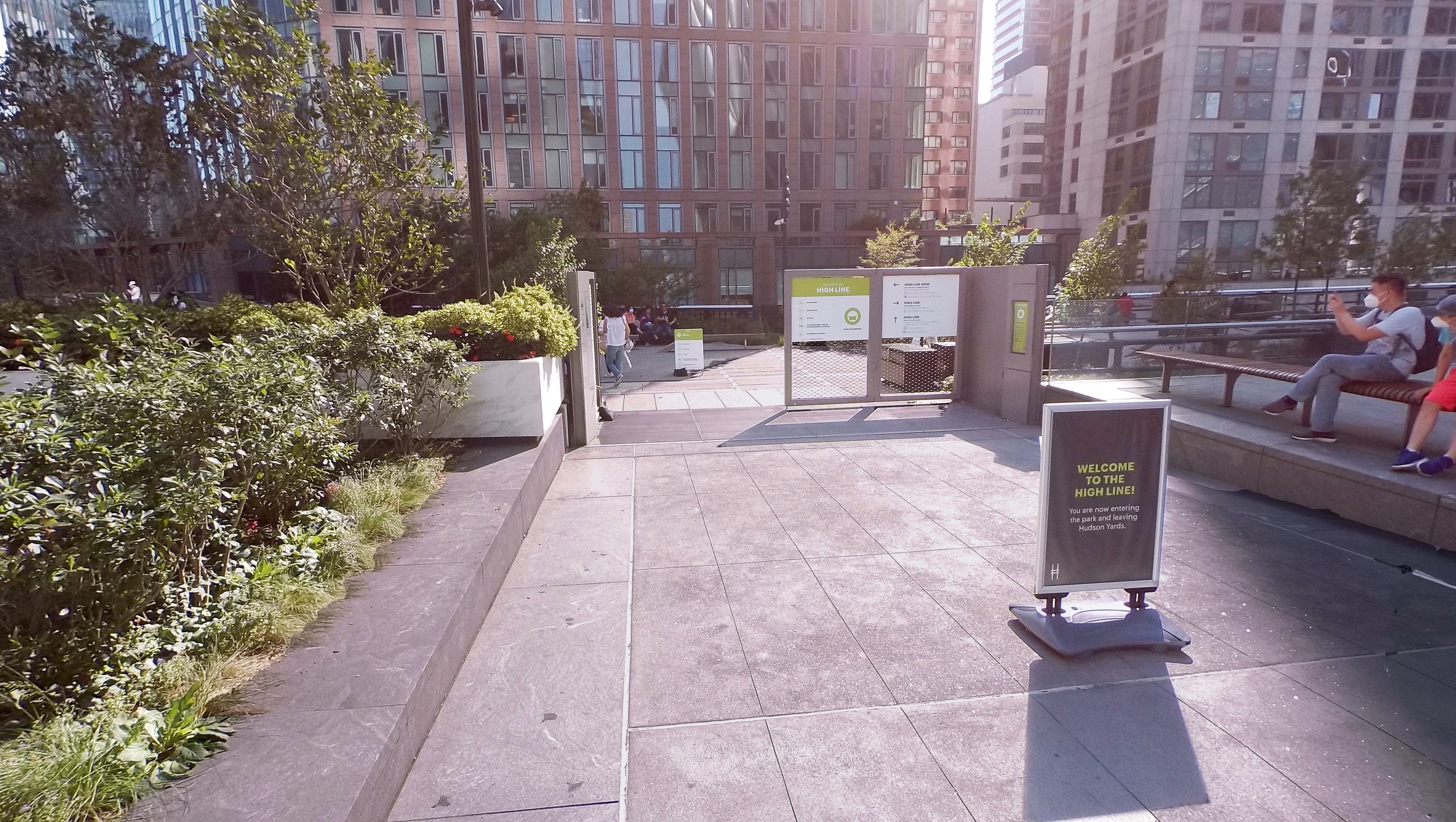 A gate marks the entrance to the High Line from Hudson Yards.