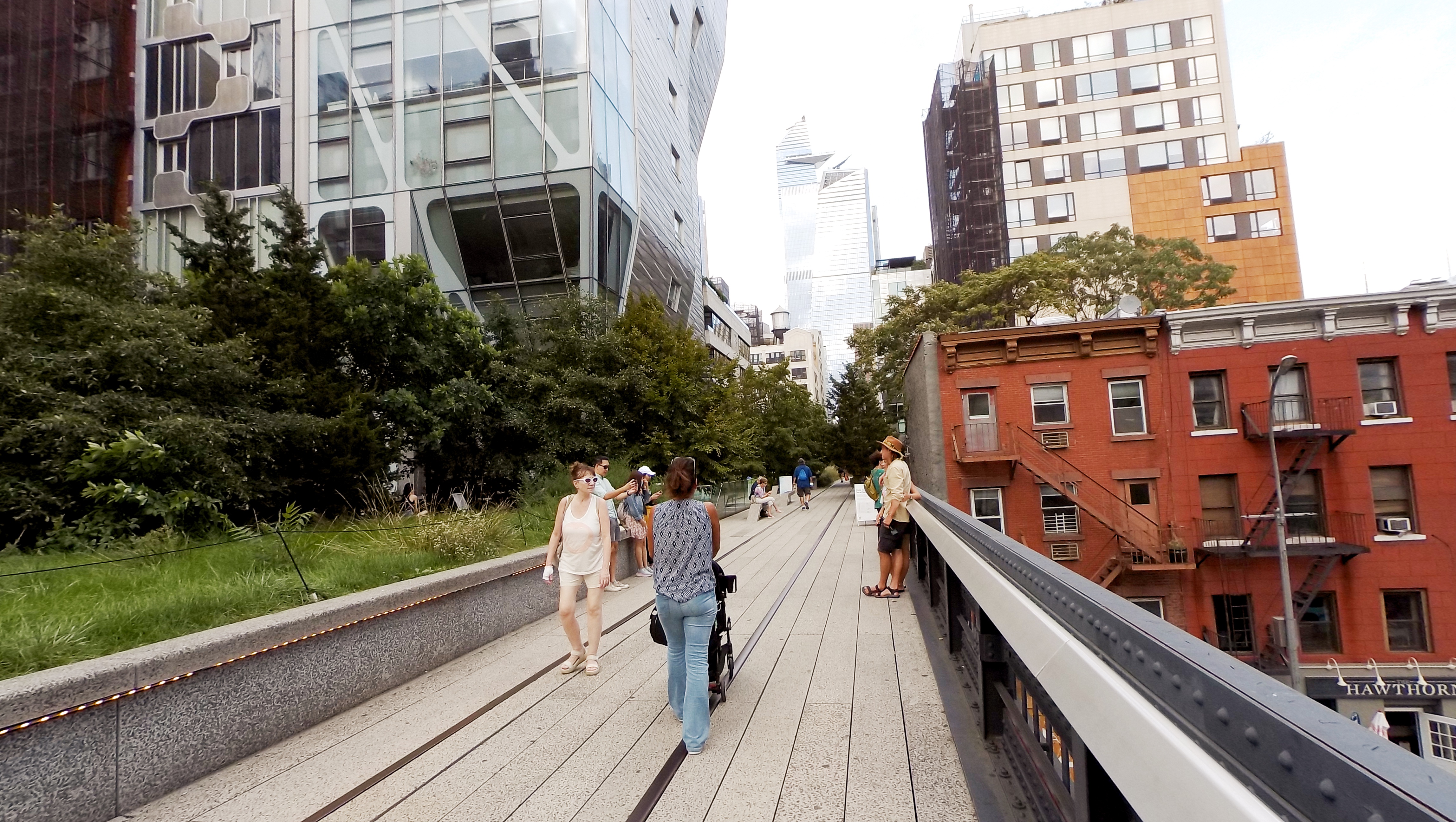 Visitors taking pictures against the backdrop at 23rd Street.