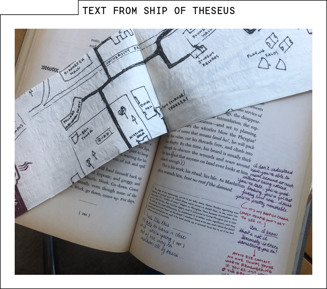 Photo of the author's copy of Ship of Theseus, open to a page containing annotations in two different handwriting styles and multiple ink colors, as well as a map drawn on a napkin.