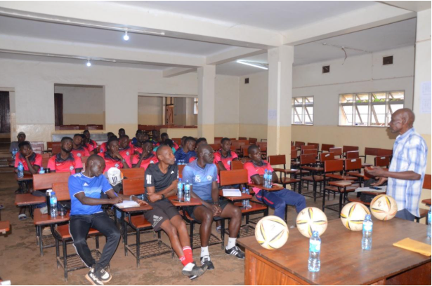 Coach Polly Ouma addressing the players and coaches at the CID headquarters in Kibuli
