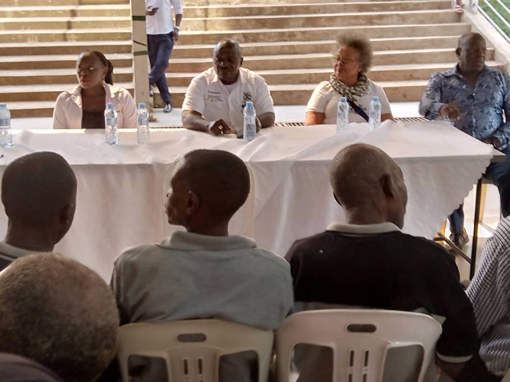 General Wamala Katumba Patron of FFI, the Kampala wandegeya rotary president on his left and Hajji Isaac Ngobya chairman of FFI addressing the executive and the community on the closing day of the medical camp 2025.