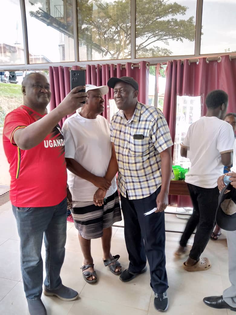 In checked shirt is Charles Baker Masiko former KCC captain and Cranes left back and in white tshirt is Fred Mukasa 'Gaso, speed merchant' former Express fc and Cranes left winger. In the checked shirt is Charles Baker Masiko, the former captain of KCC and left back for the Cranes. In the white t-shirt is Fred Mukasa 'Gaso', 'Speed Merchant' , a former left winger for Express FC and the Cranes, known for his speed, at the Medical Camp 2025. 