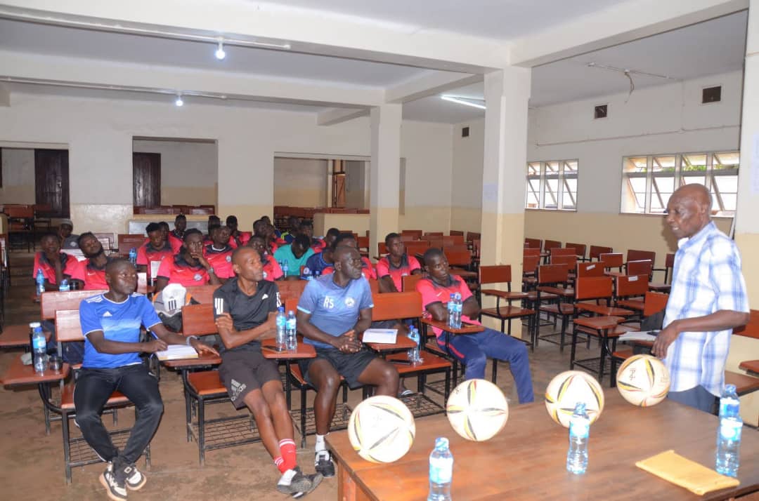 The late Polly Ouma addressing the young players