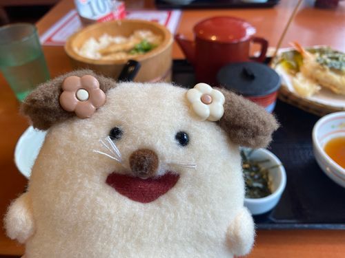 ニコッ