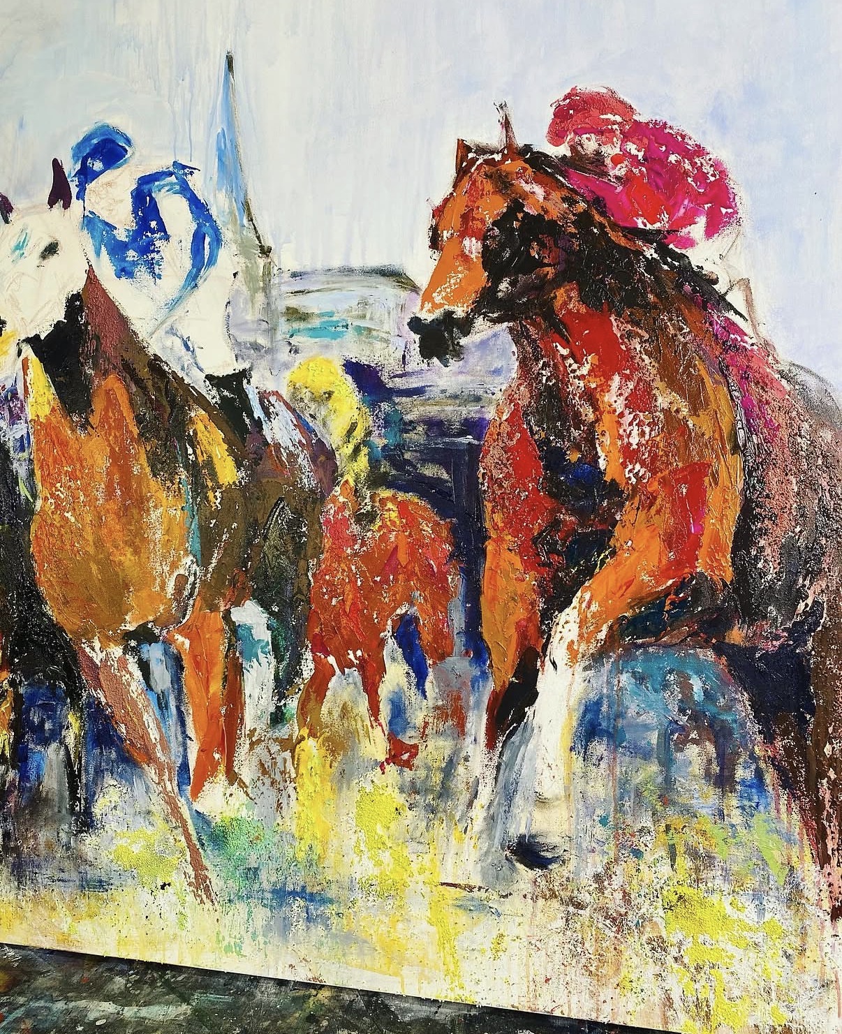 The same painting at an early stage, by Gabrielle Benot. The color is fully worked in orange, umber and yellow, while the heads, riders and bridles are still only suggested.