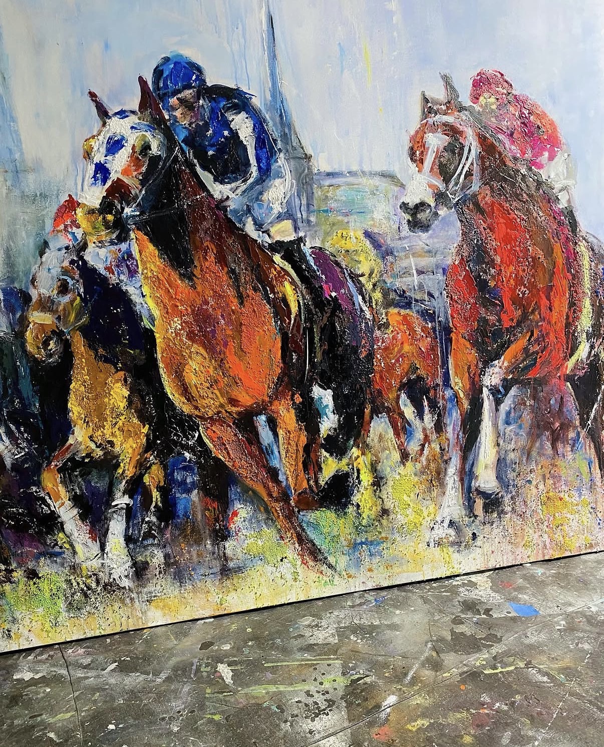 The finished canvas standing on the paint-covered floor of Gabrielle Benot's Del Mar studio.
