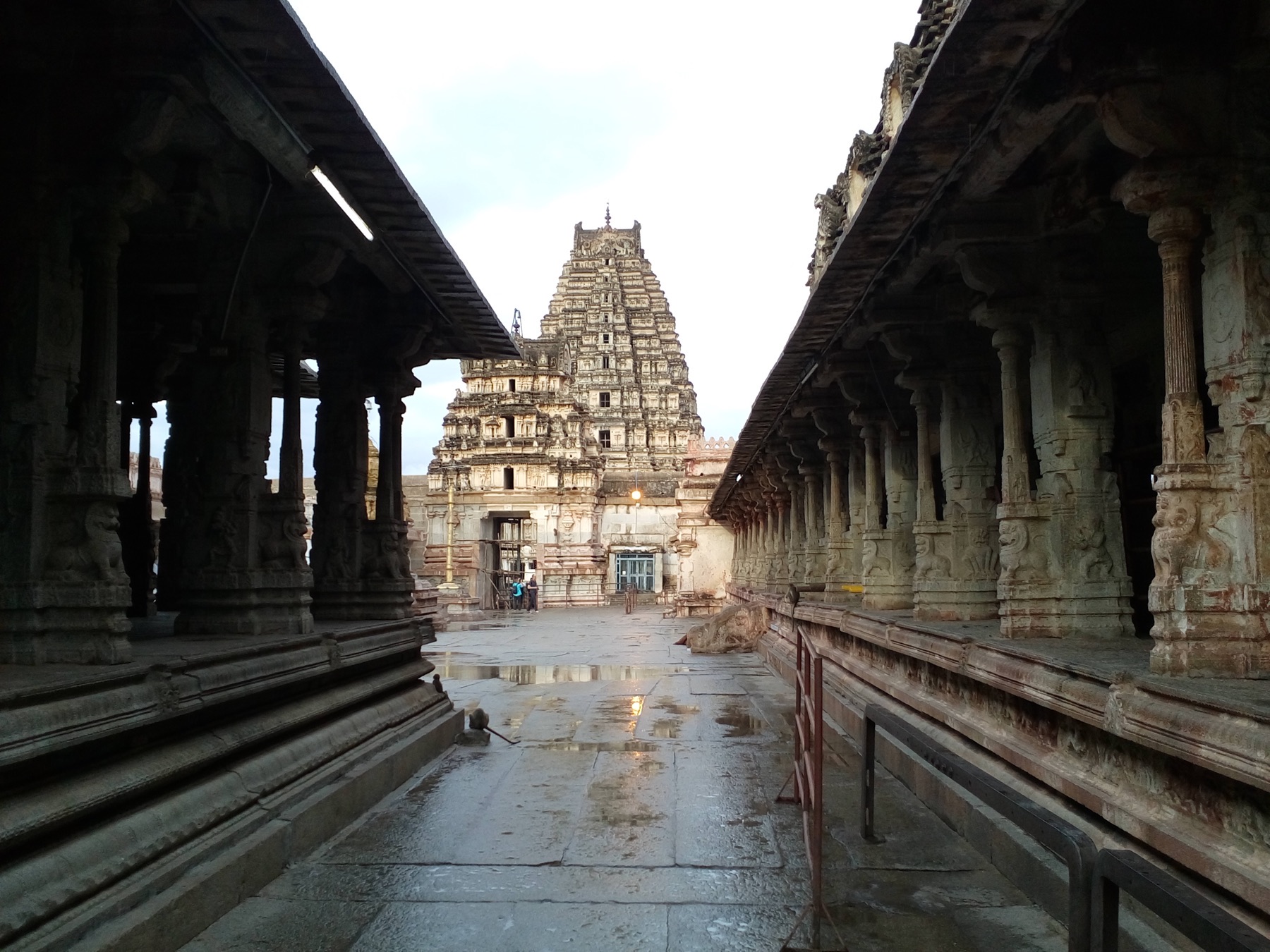 Virupaksha Temple tower framed by a Hampi courtyard