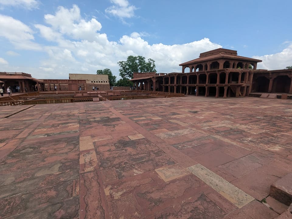 A broad red sandstone courtyard and arcades at Fatehpur Sikri