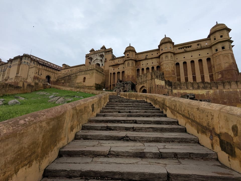 Stone steps and high walls leading through Amer Fort