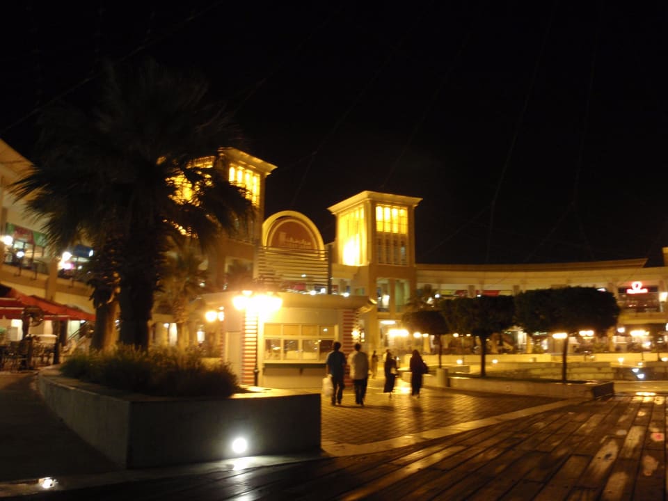 Lights along the Sharq waterfront after sunset