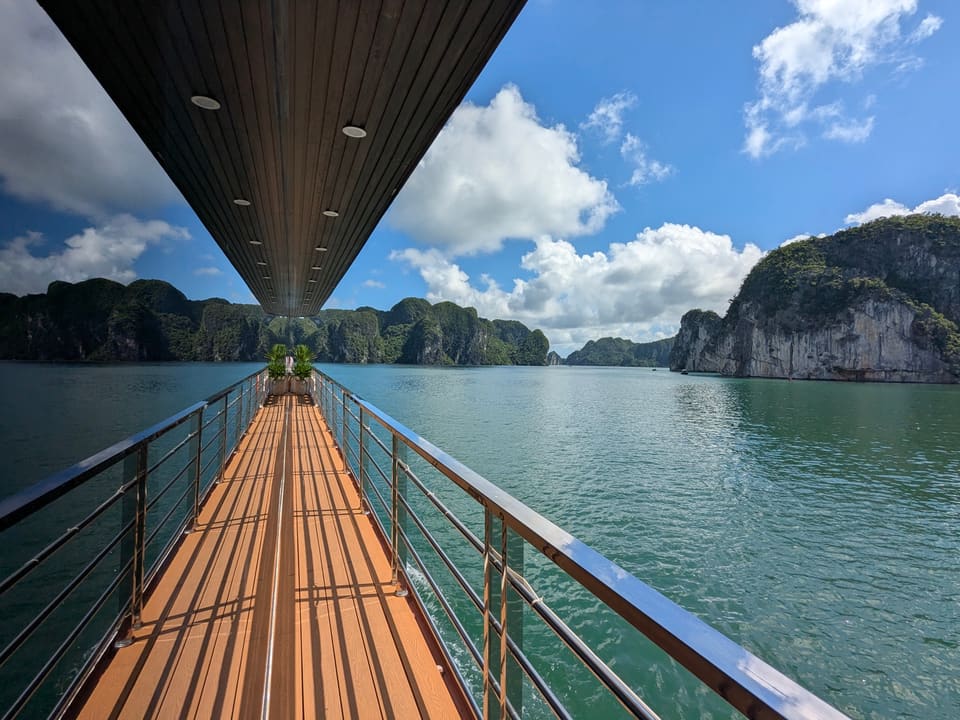 Cruise deck running beside limestone islands in Ha Long Bay