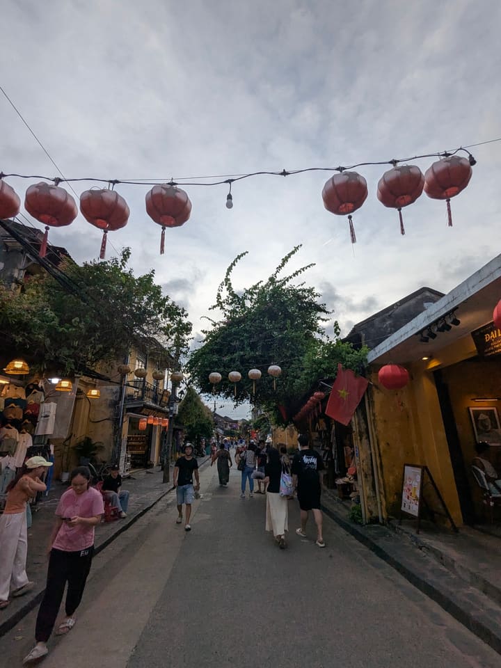 Lanterns hanging above a narrow street in Hoi An Ancient Town