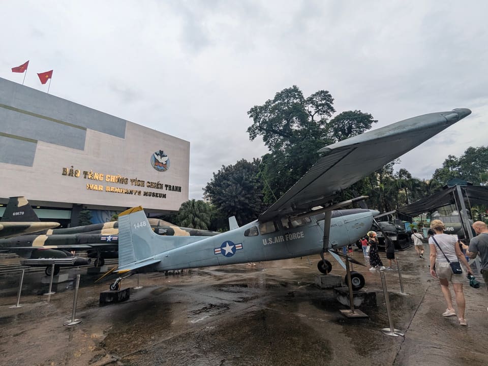 Historic military aircraft displayed outside the War Remnants Museum