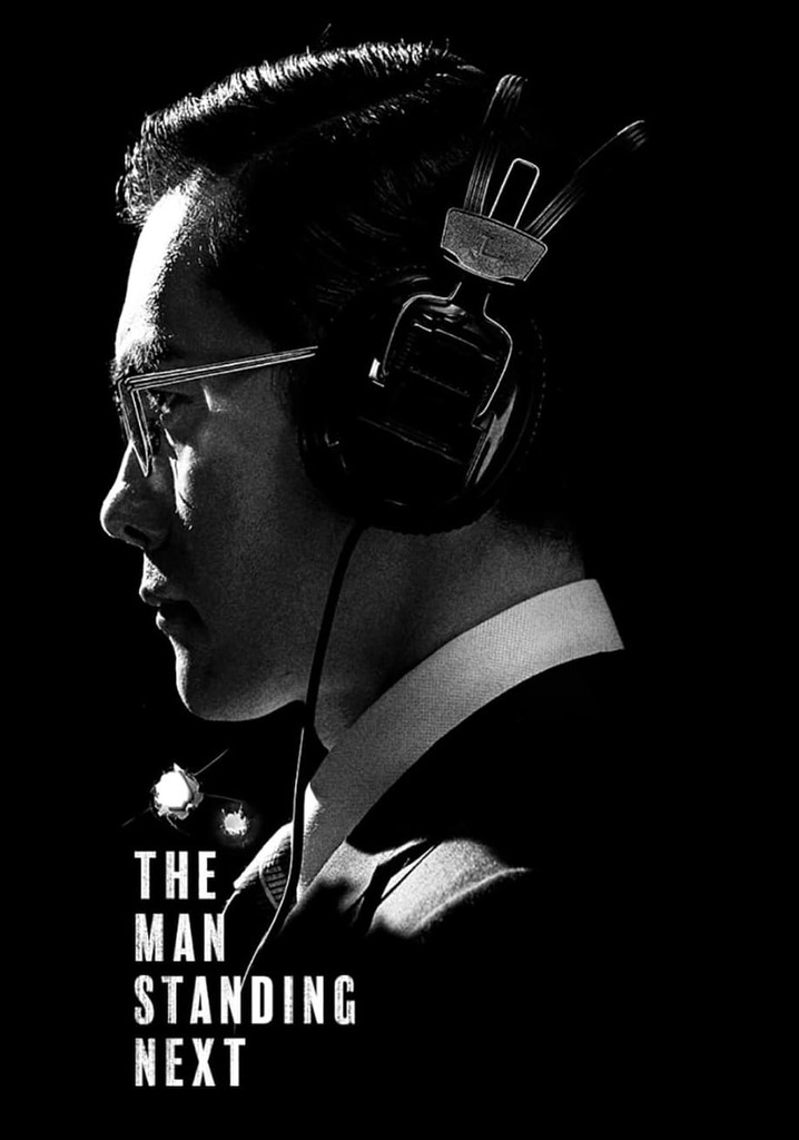 The Man Standing Next poster