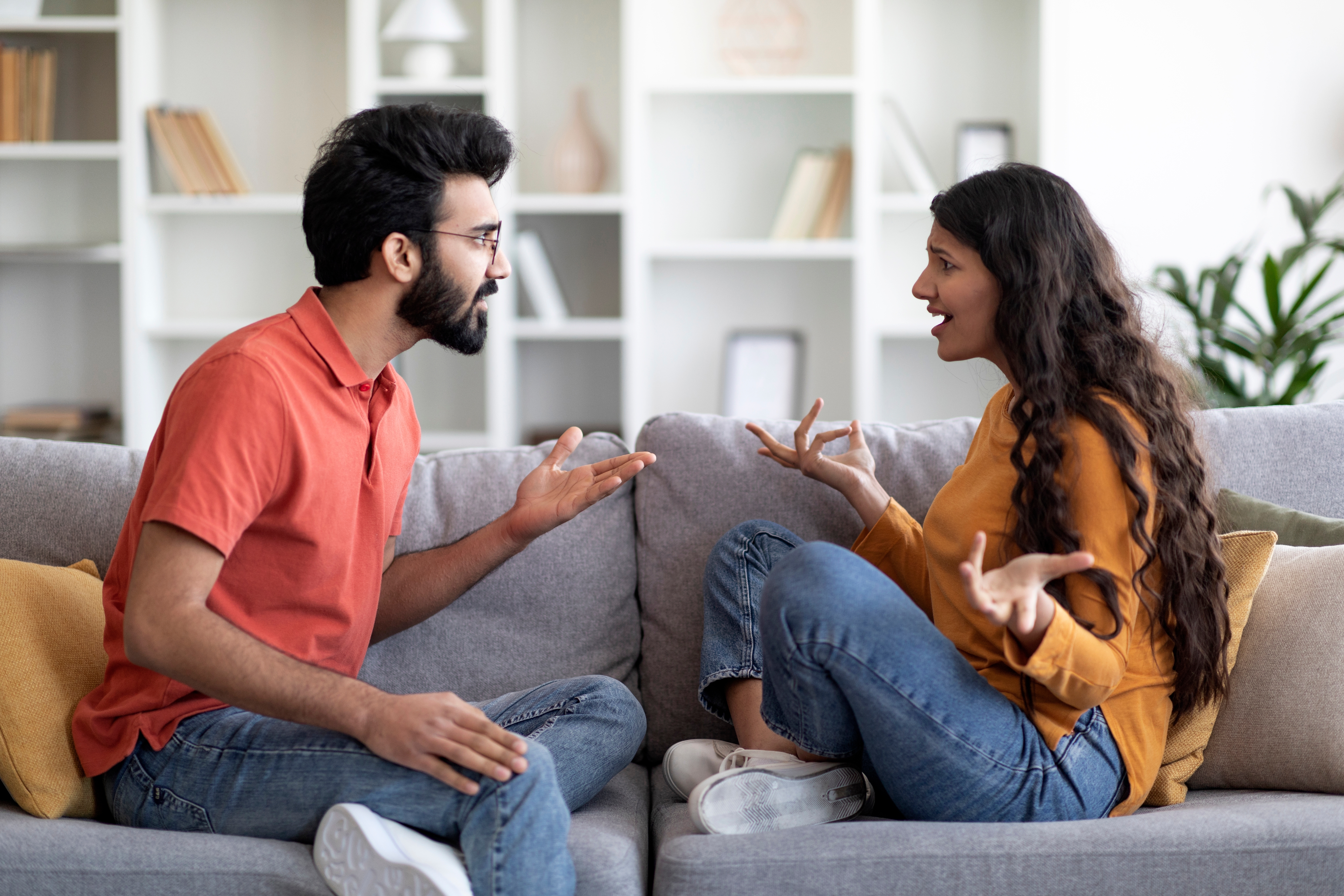 Indian couple discussing relationship issues and solutions - trust, communication, and therapy for relationship problems