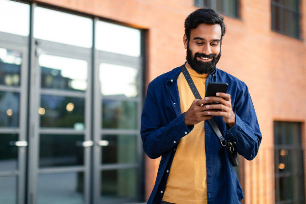 Indian Male aged 32 year old accessing mental healthcare features on the Amaha Mental Health App on his Smart phone