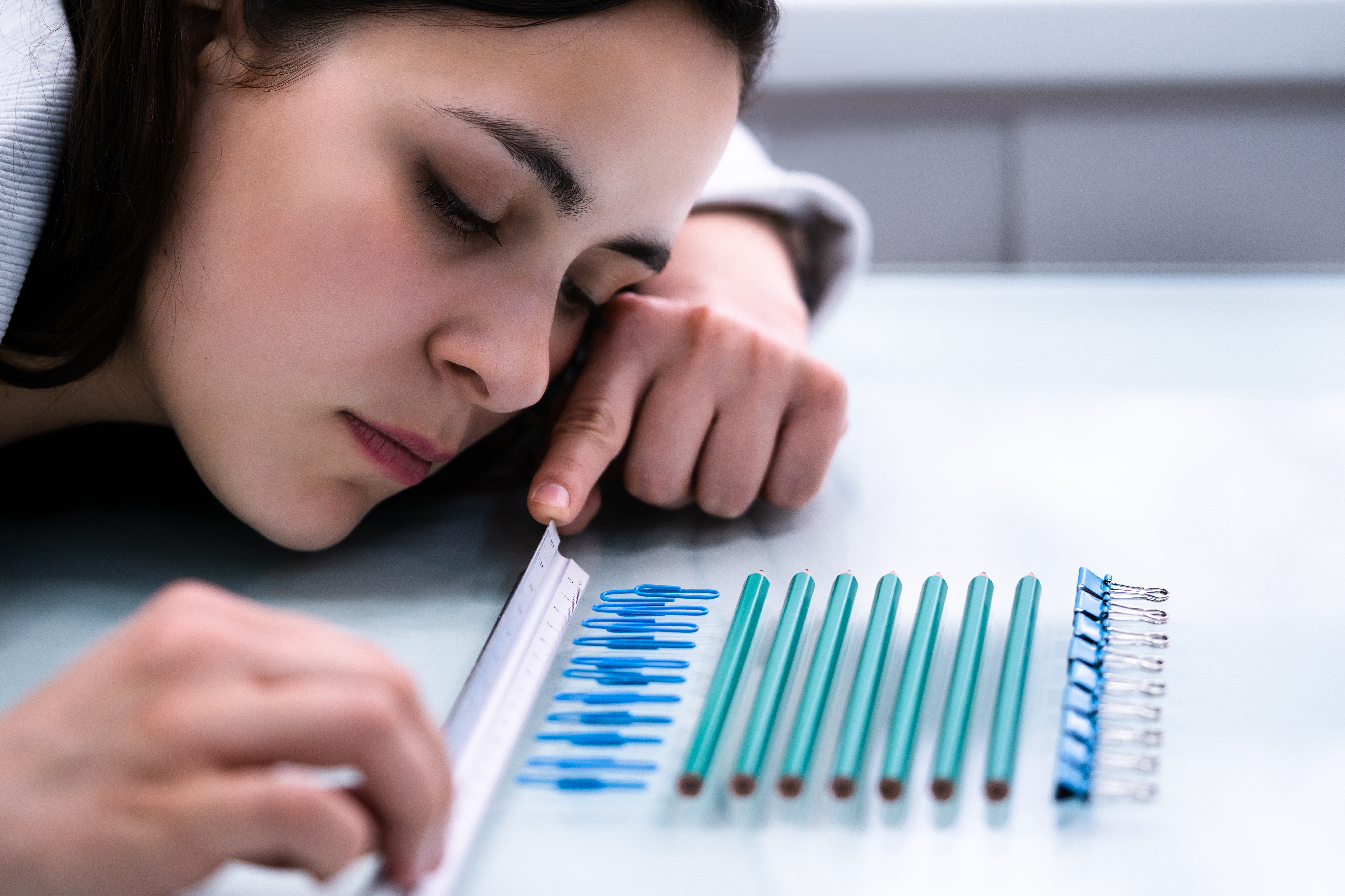Woman Arranging Objects Symmetrically As Part Of An OCD Ritual