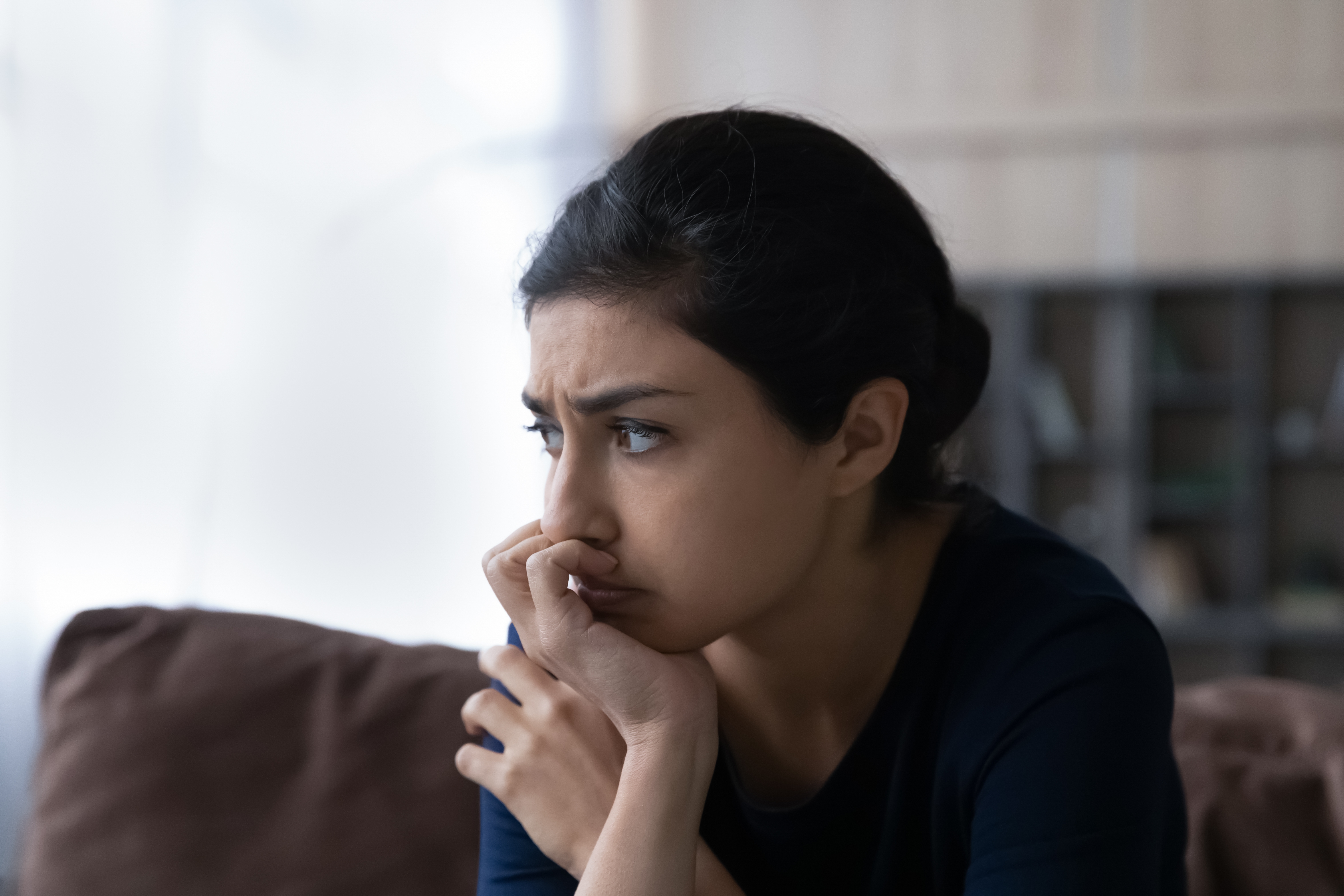 Person experiencing mental health challenges showing anxiety vs depression symptoms difference
