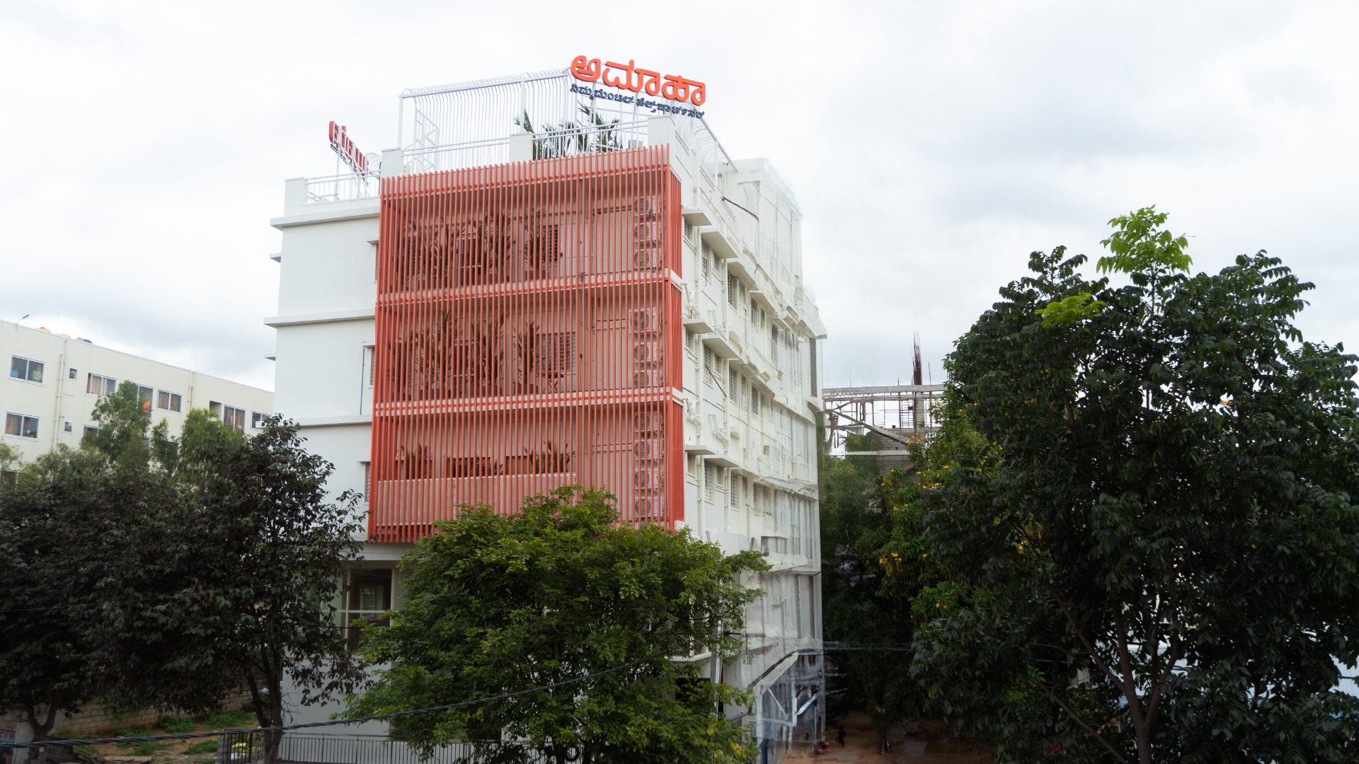 Modern hospital building with mental health care professionals consulting patients in a serene, welcoming environment representing top mental hospitals in India