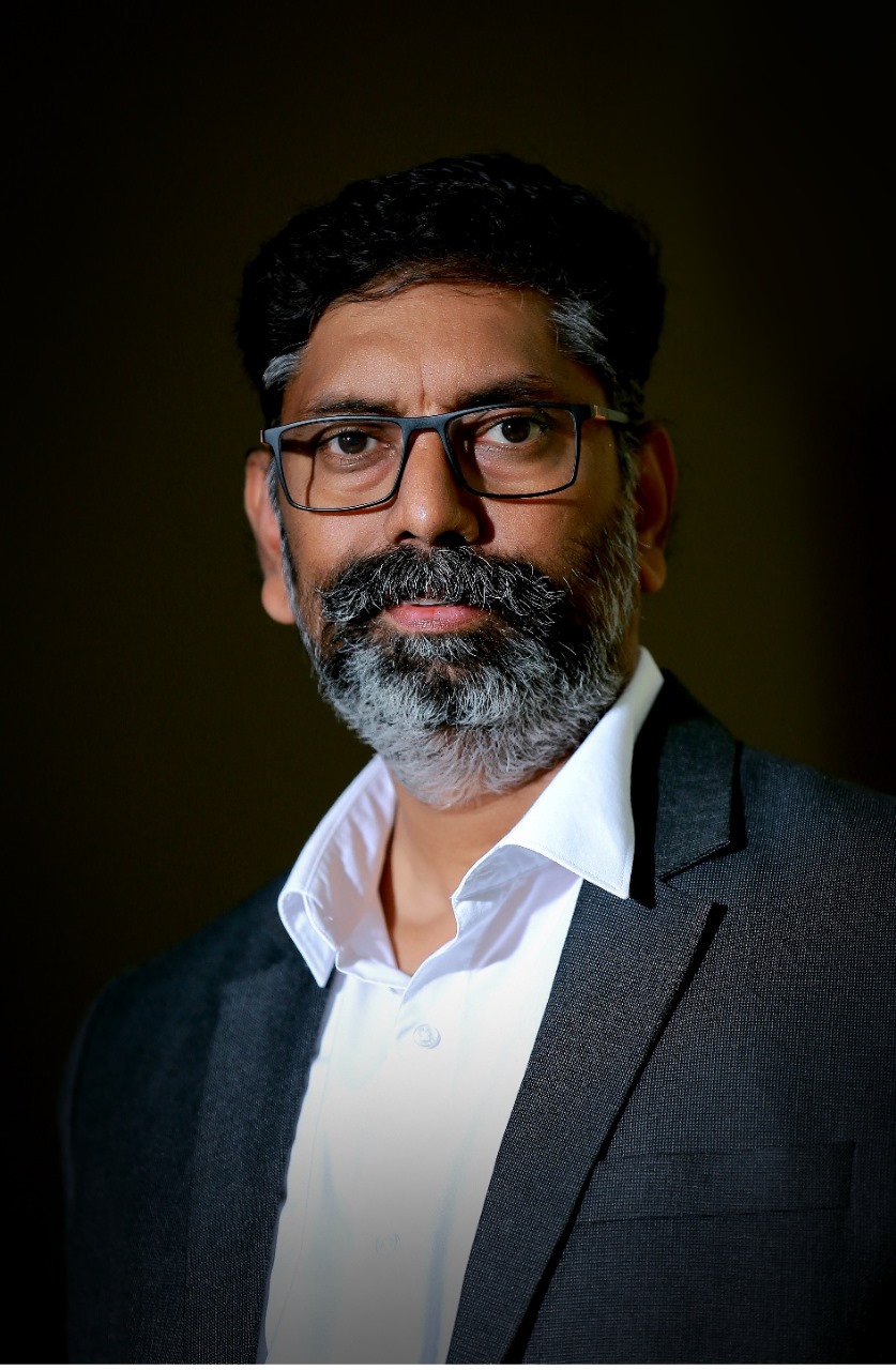 A professional portrait of an advocate.