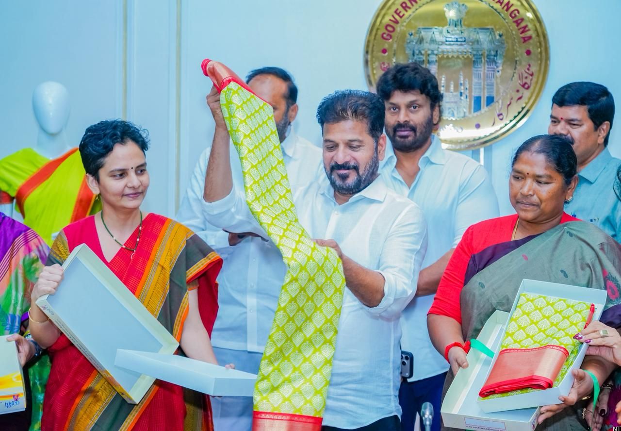Chief Minister Revanth Reddy releasing Indiramma Sarees designs for women’s groups in Telangana