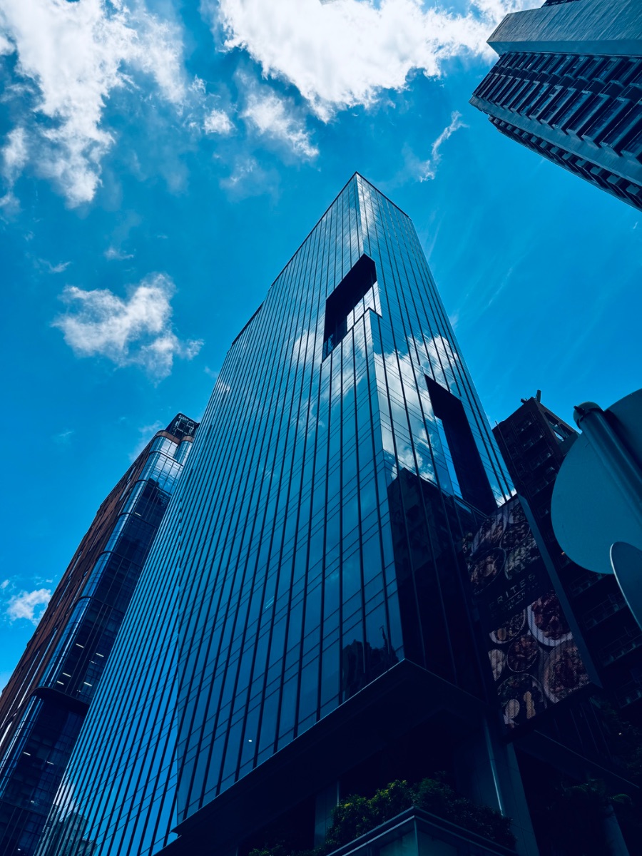 Glass, gridlines, and sky reflections