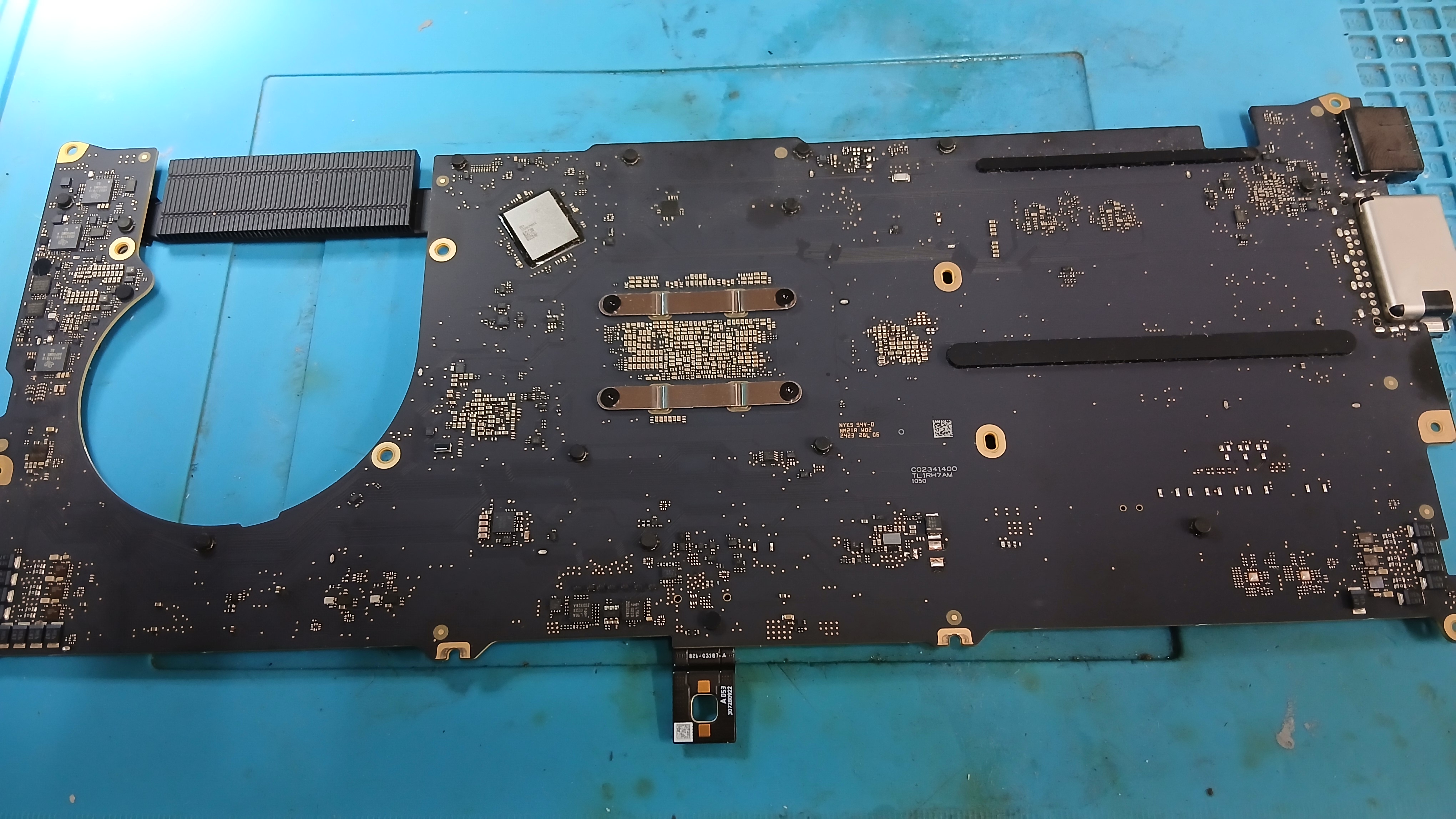 Multimeter and bench diagnostic inspection of MacBook Pro M3 motherboard