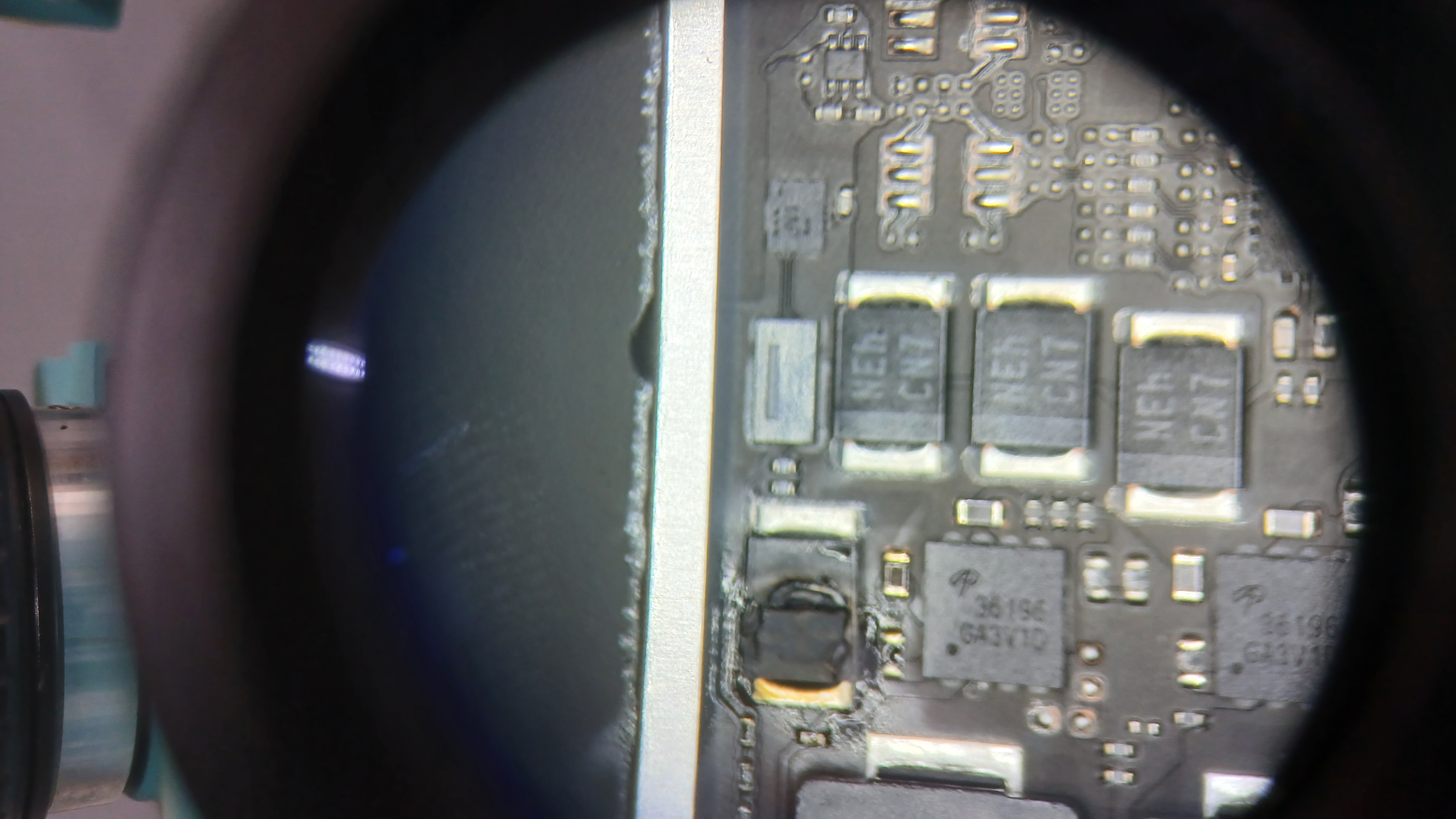 Microscopic view of shorted PP3V8_AON ceramic capacitor replacement on Apple Silicon board