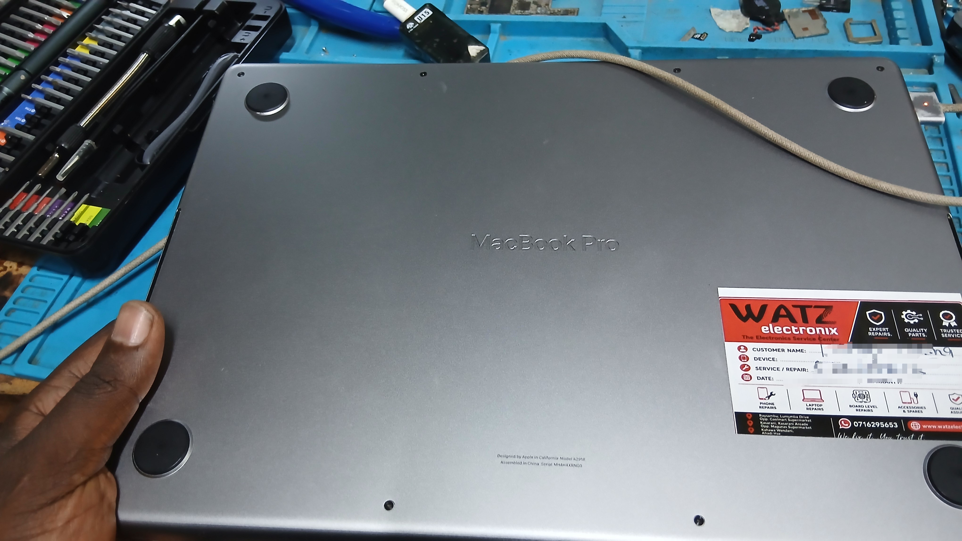 MacBook Pro M3 reassembled with factory torque specs at Watz Electronix