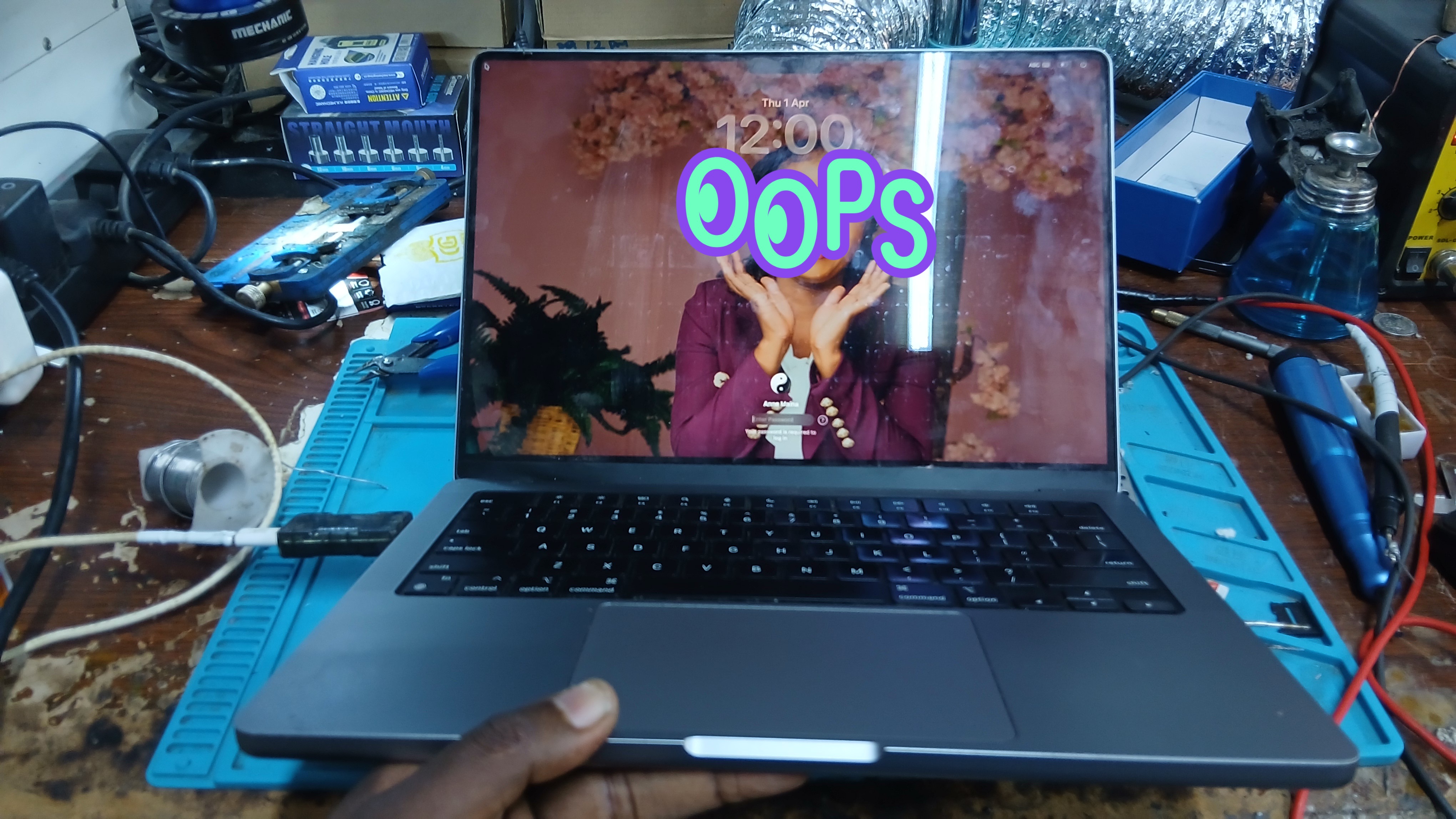 MacBook Pro M3 fully restored and booting after logic board capacitor replacement at Watz Electronix