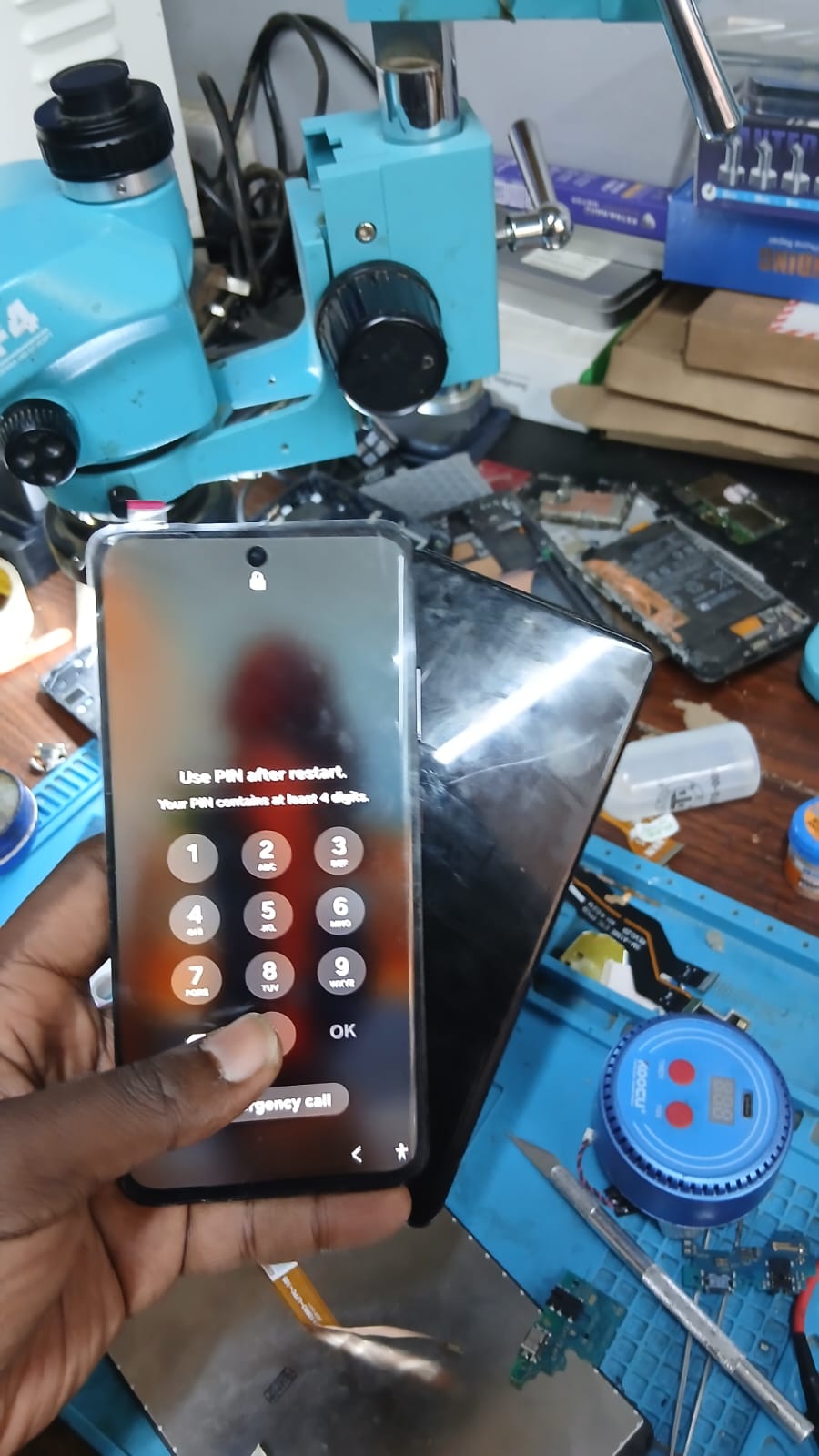 Cracked Samsung screen before and after replacement at Watz Electronix