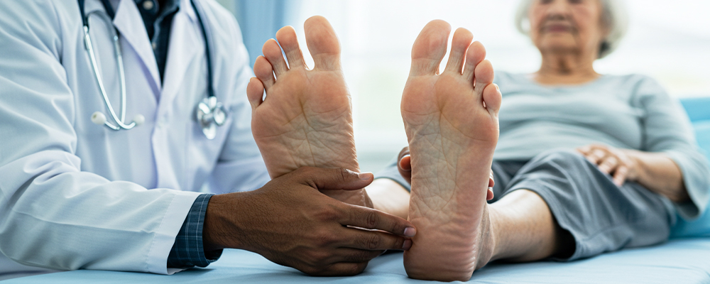 Caring hands assisting a senior with foot care