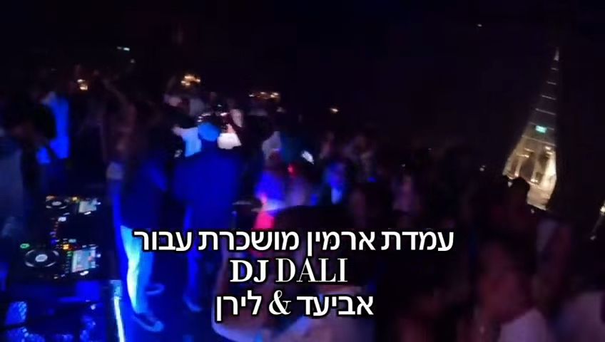 A professional DJ set at a corporate event with sleek lighting and sound equipment.